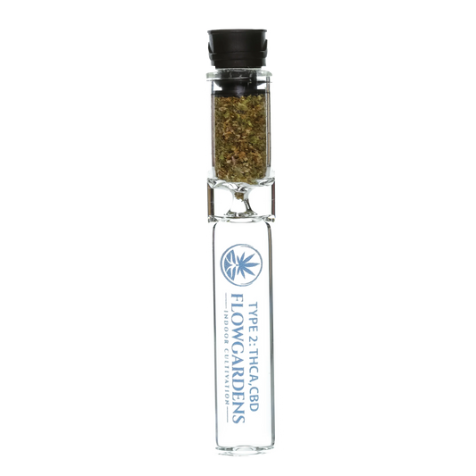 Type 2 THCA CBD glass chillum with ground cannabis and Flow Gardens branding