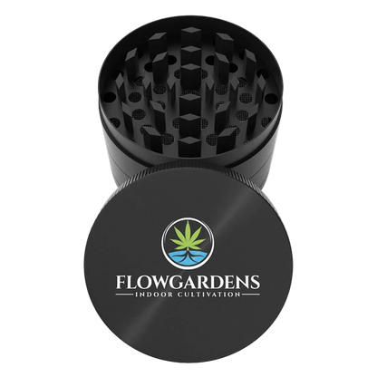 Black herb grinder with Flowgardens Indoor Cultivation logo and cannabis leaf design