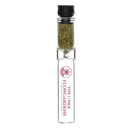 Glass chillum filled with hemp flower, labeled Flowgardens Type 1 THCA Indoor Cultivation
