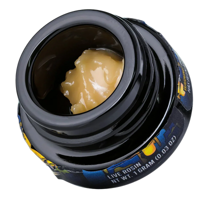Black jar of live hash rosin concentrate, 1 gram, creamy yellow color, close-up